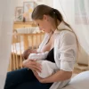 postnatal-period-with-mother-breastfeeding-child_23-2149125006